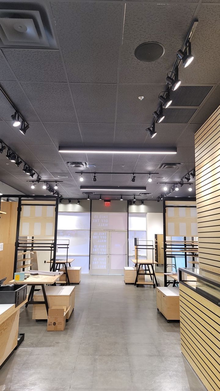 Vans store interior buildout with custom millwork, wall fixtures, and storefront entry